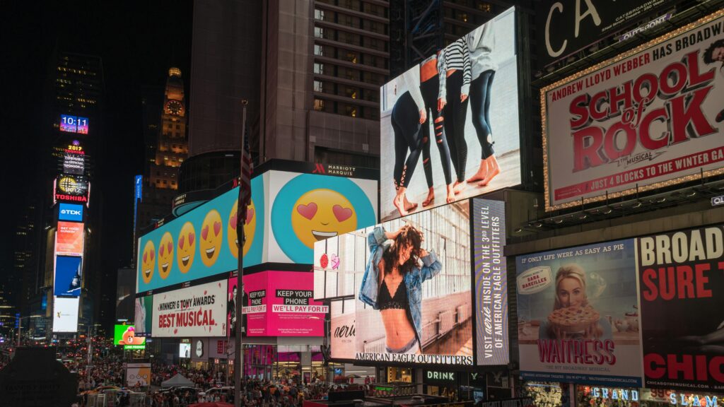 pexels-photo-1058276-1058276 Colorful billboards light up New York City's iconic Times Square at night, with vibrant ads and bustling crowds.