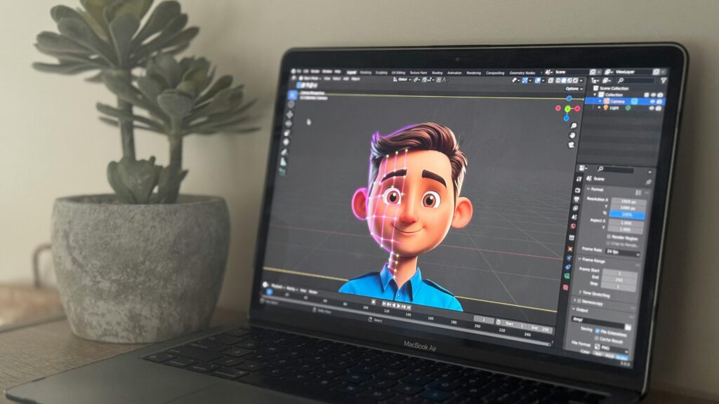 pexels-photo-28655002-28655002 Laptop showing 3D animation in creative workspace with succulent plant.